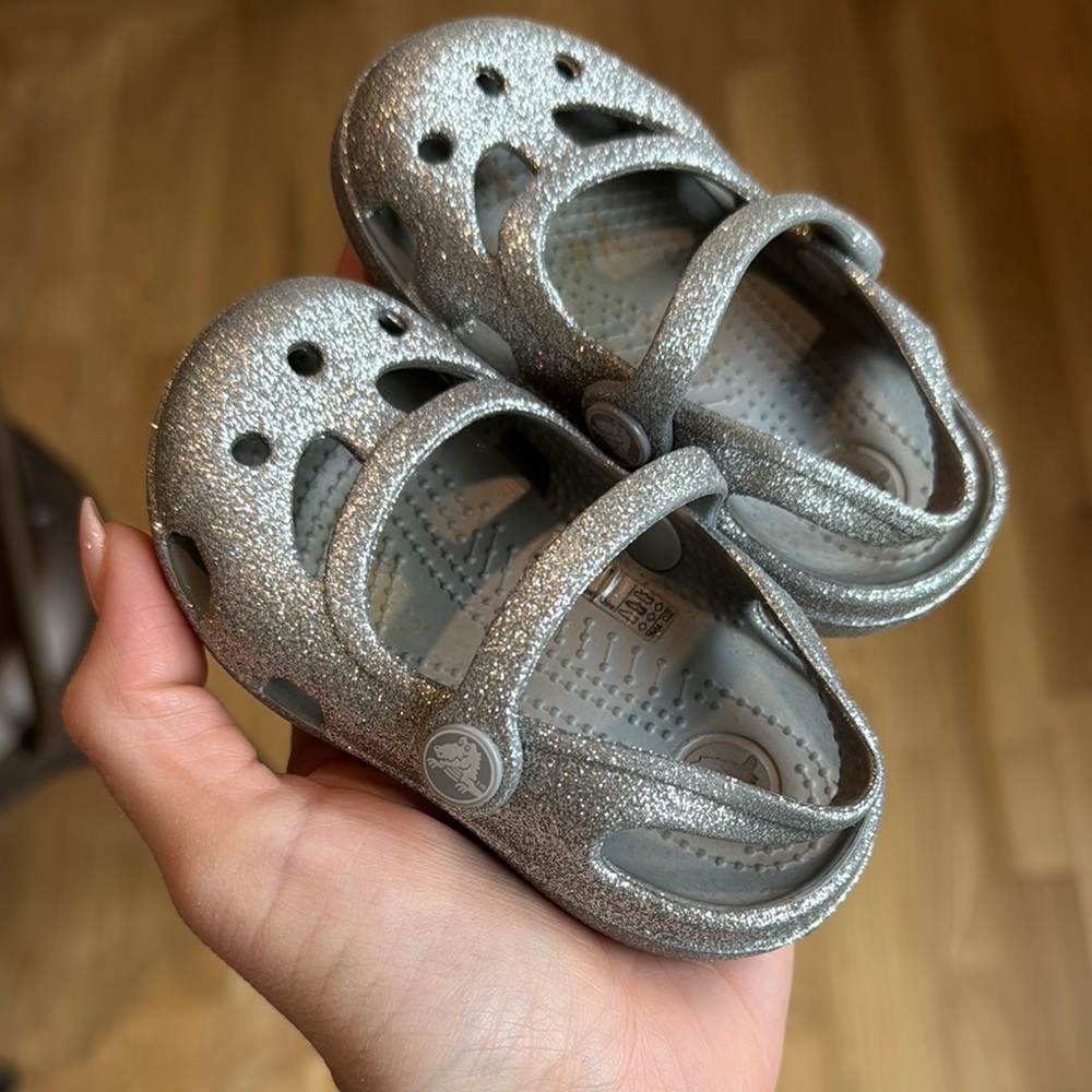 Crocs, sparkly silver baby shoes
